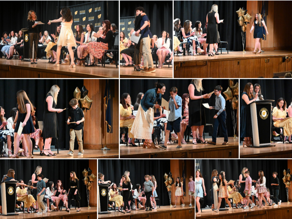 students receiving awards on stage